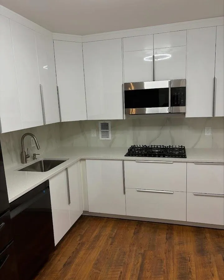 Restored kitchen with white cabinets after water damage in Smithfield